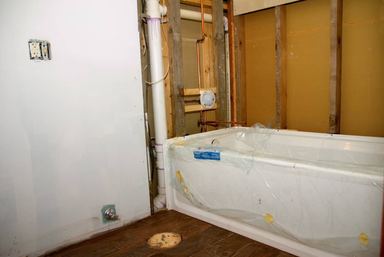 https://www.woodbridgeshowerandbath.com/wp-content/uploads/2022/11/bathtub-being-remodeled-into-a-walk-in-shower.jpeg